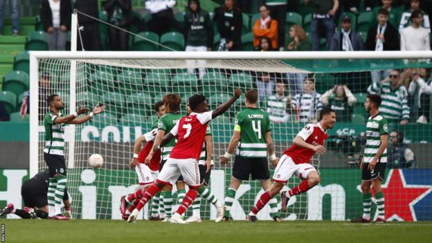 William Saliba celebrates after scoring for Arsenal against Sporting Lisbon in their Europa League last 16 first leg in Portugal