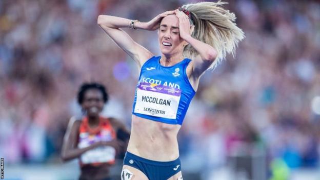 Eilish McColgan celebrates with her hands on her head after winning Commonwealth 10,000m gold in Birmingham in 2022