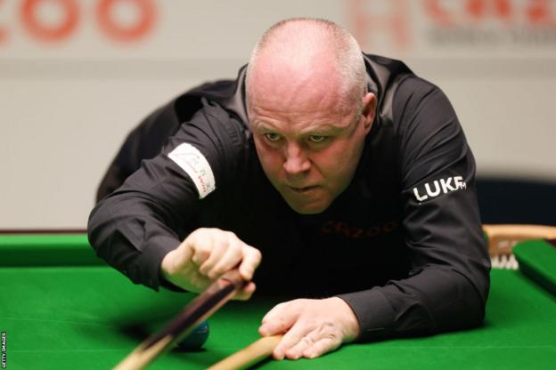 Four-time world champion John Higgins in action at the World Championship