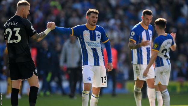 Pascal Gross and Jason Steele celebrate Brighton's 6-0 Premier League victory over Wolves