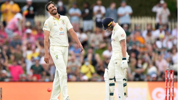 Mitchell Starc smiling after taking the wicket of England's Ben Stokes