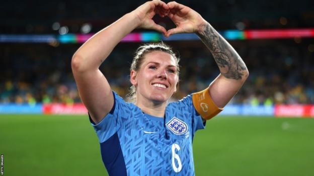 England captain Millie Bright makes a heart gesture to the crowd